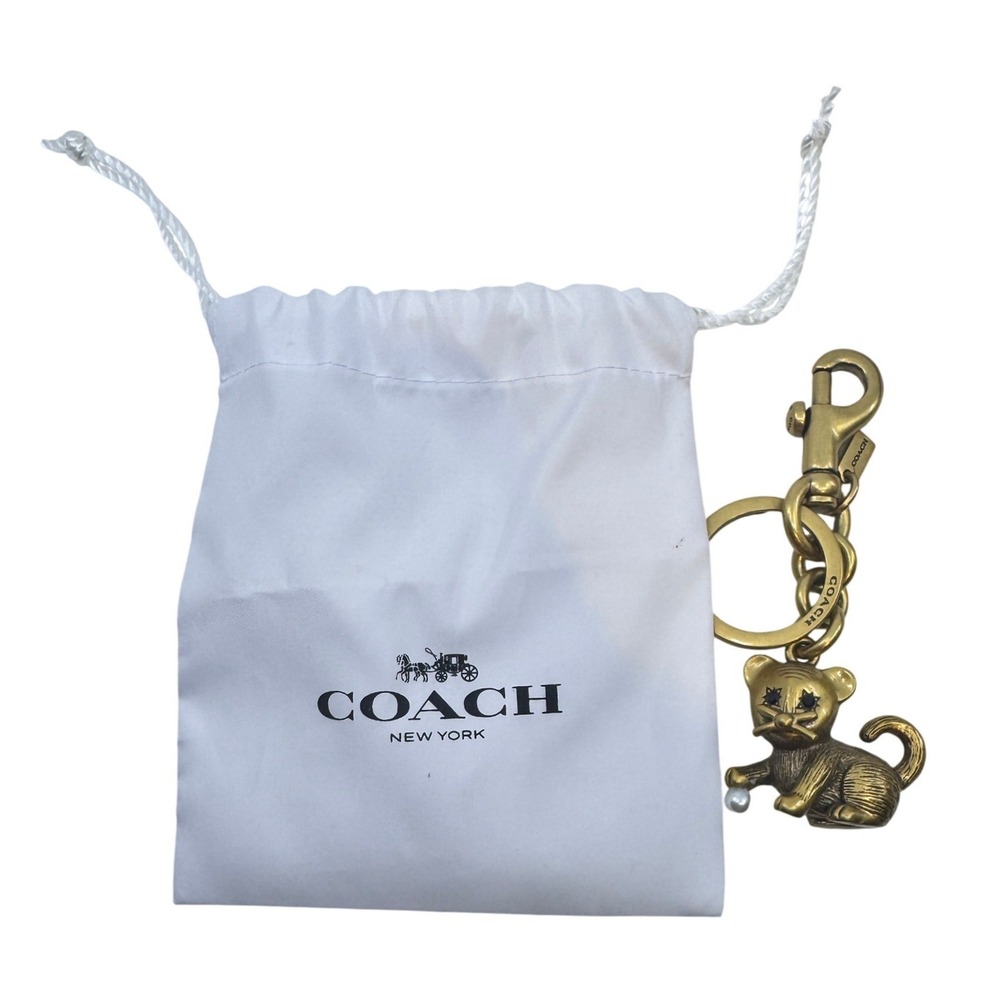 Coach Cat Bag Charm Keychain Antiqued Brass Faux Pearl Black Stone Eyes Dust Bag
